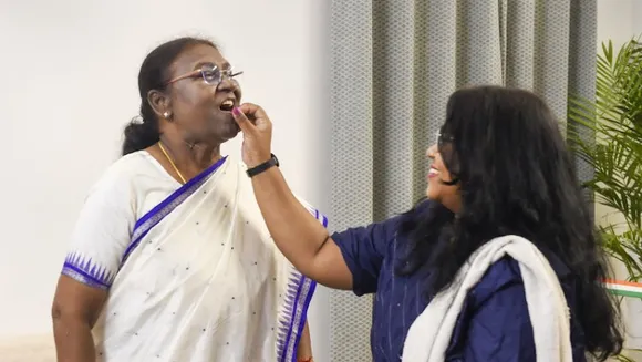 President-elect Droupadi Murmu celebrates with her daughter Itishri Murmu, in New Delhi, Thursday