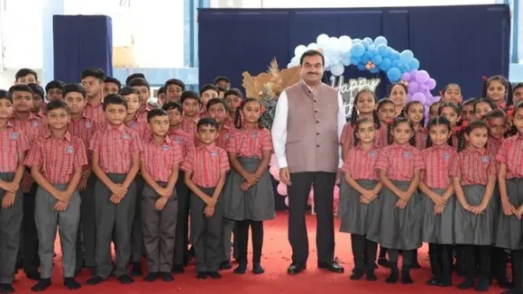 Gautam Adani celebrating his 60th birthday with school children