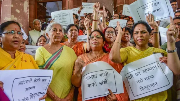 Union Finance Minister Nirmala Sitharaman with other BJP MPs during a protest against Congress leader Adhir Ranjan Chowdhurys remarks on President Droupadi Murmu, at Parliament House, in New Delhi, Thursday