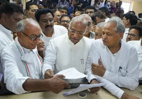 Senior Congress leader Mallikarjun Kharge files his nomination papers for the post of party President, at AICC headquarters in New Delhi, Friday, Sept. 30, 2022. Congress leaders Digvijaya Singh, Ashok Gehlot and others are also seen