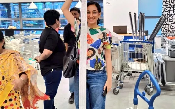 Woman’s shopping bill at IKEA taller than her