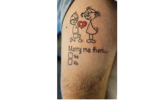 UK barber proposes to his girlfriend with 10 inch tattoo on his upper-left thigh
