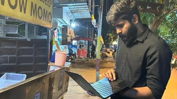 Bengaluru tech worker spotted balancing laptop at momo stall, pic goes viral