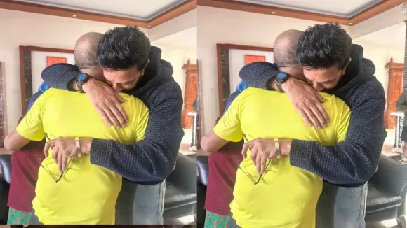 Sudeep  hugs Shivarajkumar as the latter leaves for US for his treatment