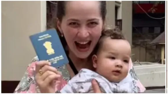 Russian woman celebrates gaining overseas citizenship of India