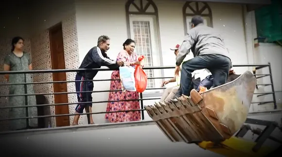 Innovative rescue: JCB delivers food packets and ration in waterlogged Sai Layout of Bengaluru
