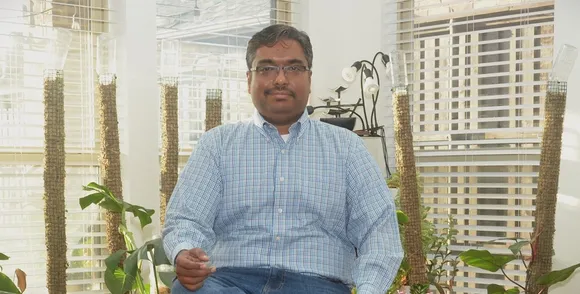 Automotive DevOps pipeline showing bi‑weekly production-like merges, QA gates, and controlled promotions to production.