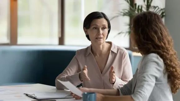 HR professional reviewing employee benefits compliance documents including EPF ESI gratuity and group medical insurance