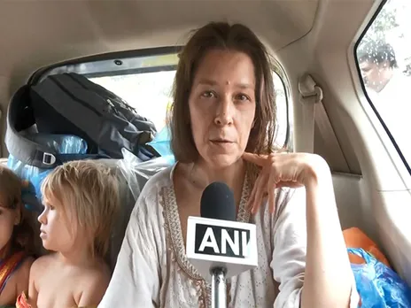 Russian woman Nina Kutina with her children after being rescued from a cave near Gokarna by police and processed by FRRO officials in Bengaluru (Photo/ANI)
