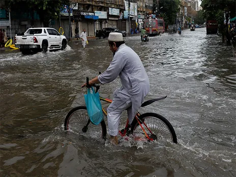 Residents navigate flooded streets as heavy monsoon rains lash Punjab, Pakistan (Source: Reuters)