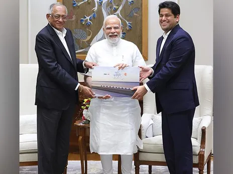 Prime Minister Narendra Modi with Venu Srinivasan and Sudarshan Venu of TVS Motor Company (Photo Credit: X/@tvsmotorcompany)