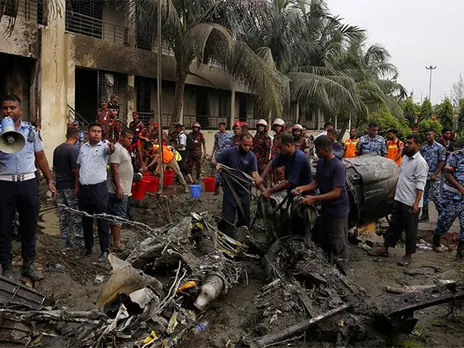 Firefighters work to remove the wreckage from a building, after an air force training aircraft crashed into Milestone College campus, in Dhaka (File Image/ANI)