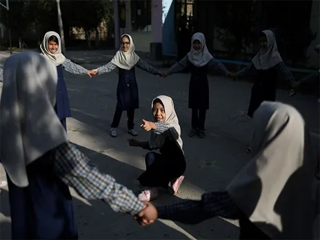 Afghan girls play in a school courtyard in Kabul, Afghanistan (File Photo/Reuters)