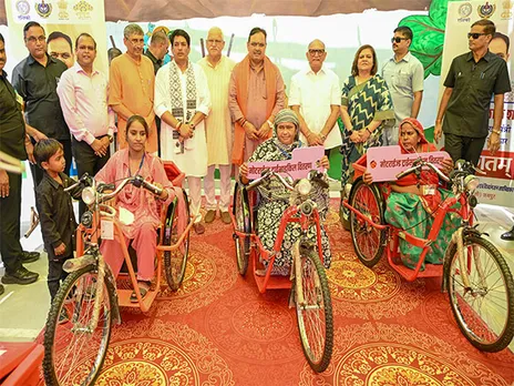 Rajasthan Chief Minister Bhajanlal Sharma distributes motorised tricycles to specially abled people (Photo/ANI)