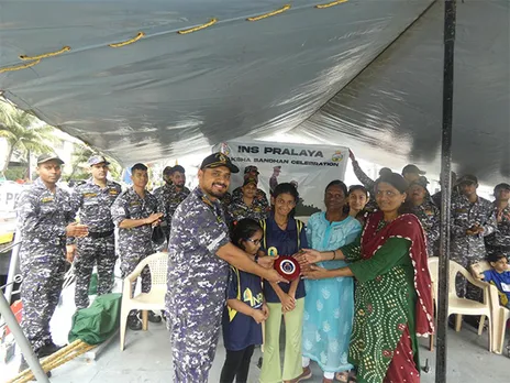 Specially-abled girls from the Anandi Foundation ties Rakhi to Navy personnels (Photo/@IN_HQMNA)