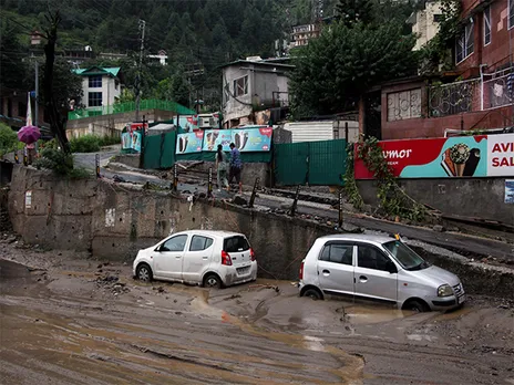 Vehicles stand stuck in silt following heavy rain in Kullu. (Photo/ANI)
