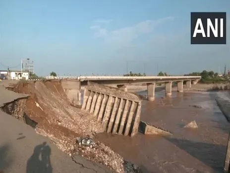 A portion of the road along the fourth Tawi bridge has been washed away in the floods (Photo/ANI)