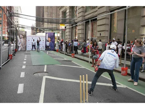 Passersby participated in a game of box cricket on Park Avenue, organized by Cricmax Connect