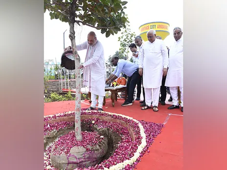 Union Home Minister Amit Shah,  CM Bhupendra Patel during the tree plantation drive at Ghatlodia. (Photo/ANI)