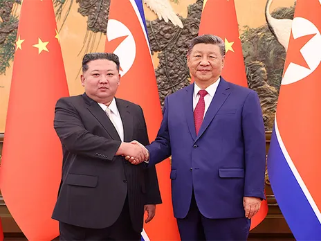 Chinese President Xi Jinping shakes hands with North Korean leader Kim Jong Un at the Great Hall of the People in Beijing, China (Photo/Reuters)