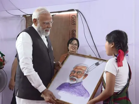 Prime Minister Narendra Modi interacts with locals in Manipur (Photo/ANI/DD)
