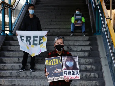 Pro-democracy supporters protest to urge for the release citizen journalist Zhang Zhan outside China's Liaison Office, in Hong Kong (Photo/Reuters)