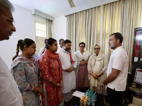 Congress MP Rahul Gandhi with family of IPS Puran Kumar (Photo: ANI)