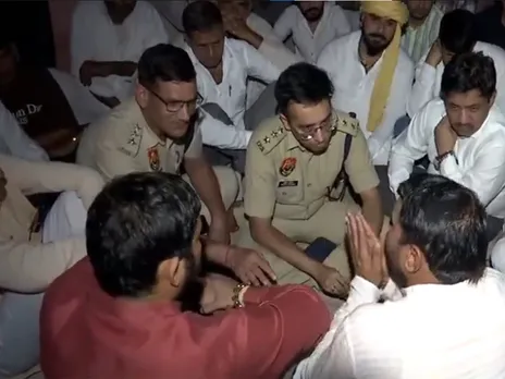 Rohtak ASP Pratik Agrawal and SDM Ashish Kumar meet with family members of ASI Sandeep (Photo/ANI)