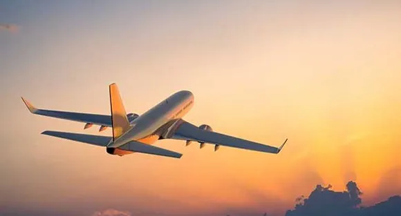 Drunk British man tries to open flight emergency door