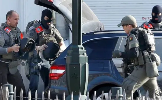 Shots fired at Brussels police in raid linked to Paris attacks