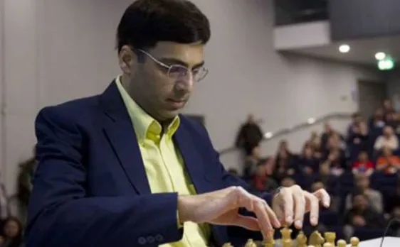 Anand beats Karjakin to come back in joint lead