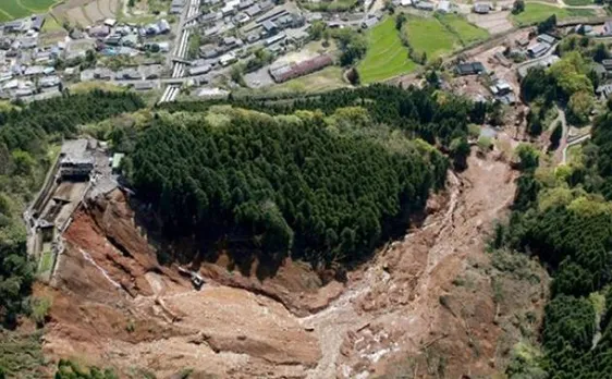 Rescuers race against landslides to reach Japan quake victims