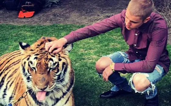 Justin Bieber celebrates father's engagement party with Bengal tiger