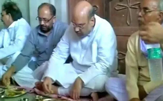 Amit Shah eats meal with Dalit family in Varanasi