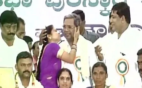 Woman kisses Karnataka Chief Minister Siddaramaiah in public