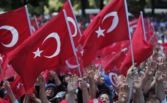 Turkey fires 24,000 teachers, police in coup plotters hunt