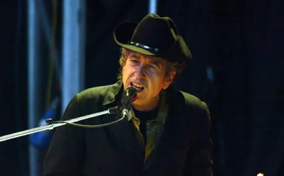 Bob Dylan removes mention of Nobel Prize on website; doubts over whether he will receive award
