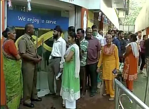 In Pics: People throng banks to withdraw new high-denomination currency