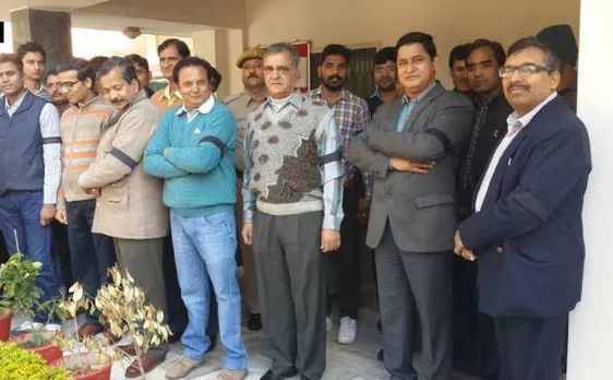 IRS employees wear black bands on arms to protest against GST
