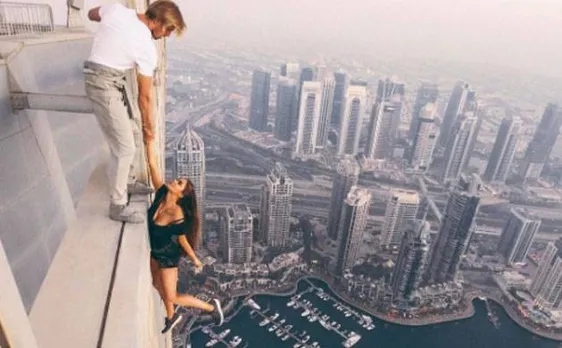 Watch: Russian Model risks life for near-death photoshoot, dangles off 1,000 ft skyscraper in Dubai