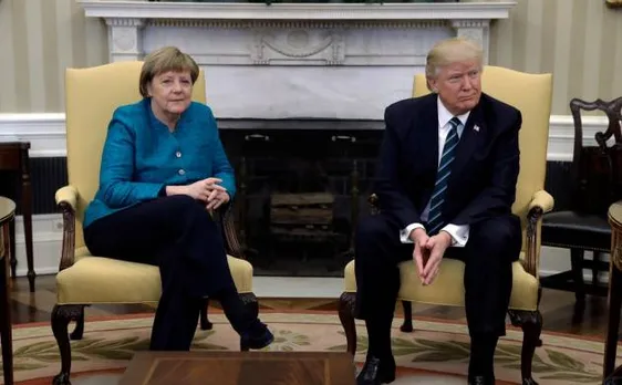 Donald Trump holds maiden talks with Angela Merkel, denies handshake, says he is not an isolationist