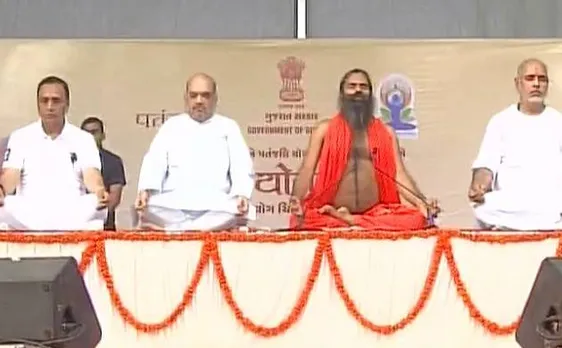 Video | International Yoga Day: Amit Shah joins Ramdev to perform yoga on a rainy day in Ahmedabad