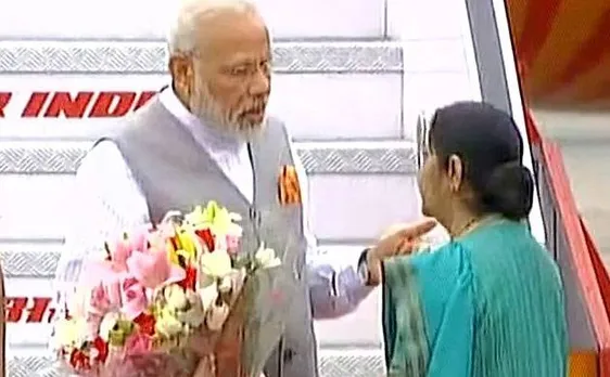PM Modi returns to India after successful tour of US, Portugal and Netherlands, Sushma Swaraj receives him at Delhi airport