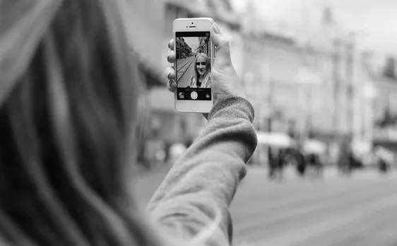 Women take selfies from above head height to make good impression