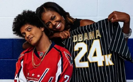 Bruno Mars gifts Michelle Obama personalised baseball jersey from his 24k Magic World Tour