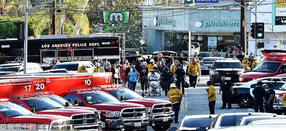 Shooting suspect in police custody after standoff at US market, 1 woman killed