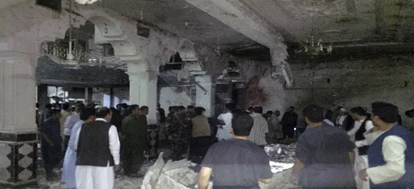 Twin suicide blasts kill at least 20 inside Afghan Shiite mosque