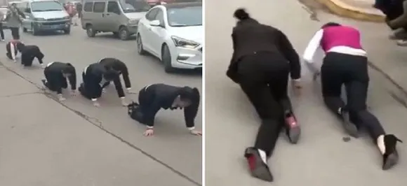 Staff at a Chinese company forced to CRAWL on the street after failing to hit their 'annual targets'