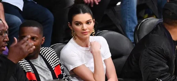 Plastic booties and the Jenners, after Kylie, Kendall spotted wearing plastic heels for a Play Ball game