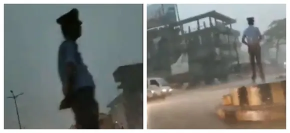 Duty above everything: Assam traffic cop stands guard amidst thunder storm, becomes star on social media